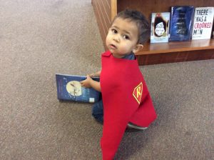 Image of a Child with super reader cape for 1000 Books Before Kindergartenen
