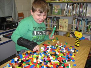 Decorative image of child playing with Legos